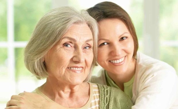 two women smiling together