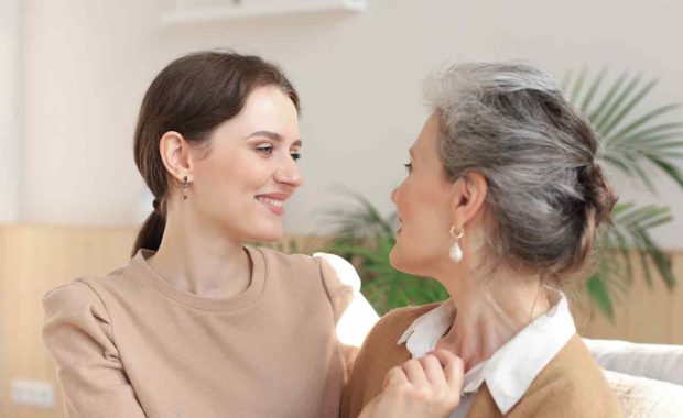 older women and younger volunteer happy in their home