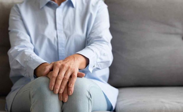 women sitting at her home alone on the couch