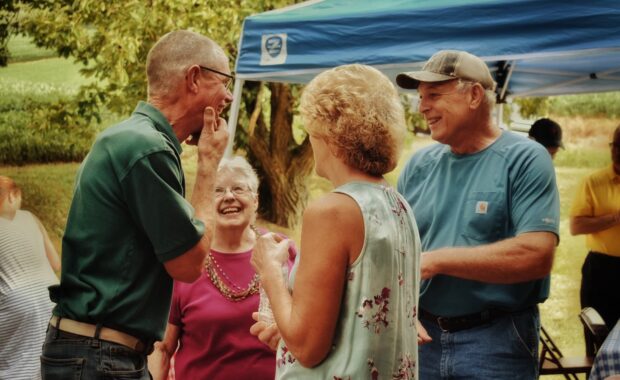Seniors at outdoor event laughing