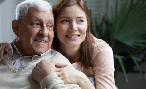 loving attentive caring granddaughter hugging elderly 75s grandfather
