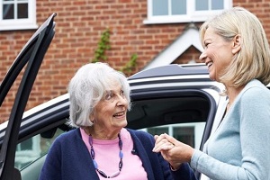 young women helping an aging parents