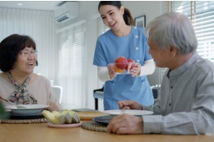 young senior asian citizen couple happy sit with at home senior care services