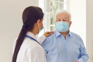 doctor with senior man doing a Senior Check In