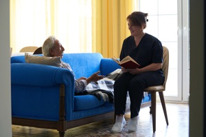 helpful caregiver at nursing home