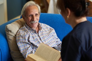 helpful caregiver at nursing home for a Friendly Visitor Program