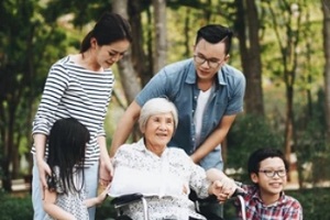 asian family taking care of old mother