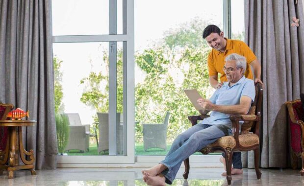 man with old father using digital Tablet while planning budget finance
