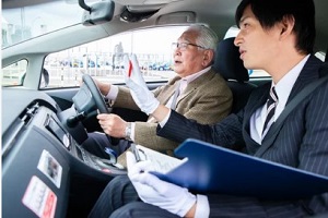 old man during driving exercise