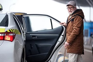 old man taking taxi
