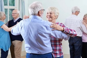 senior couple dancing in hobby club