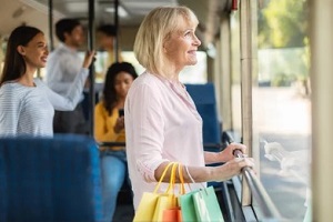 senior man traveling in public transport