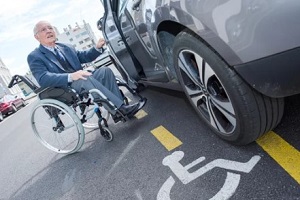 transporting senior man on wheelchair
