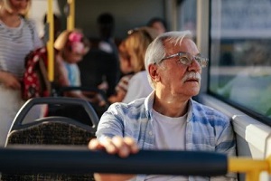 senior man in public transport