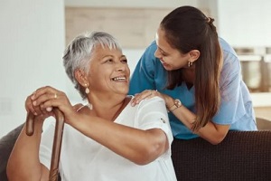 caregiver with old lady with stick
