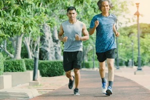 older men and young men are jogging together in the morning