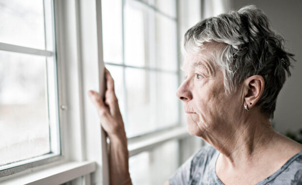 sad lonely 70 years old senior in is apartment