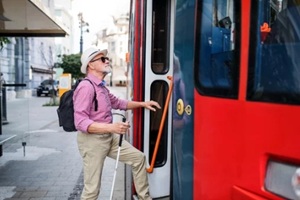 old man taking public transport