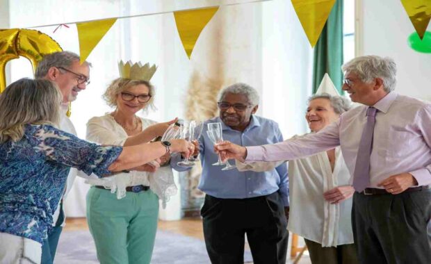 Elderly People Celebrating Long Lasting Friendship with Champagne