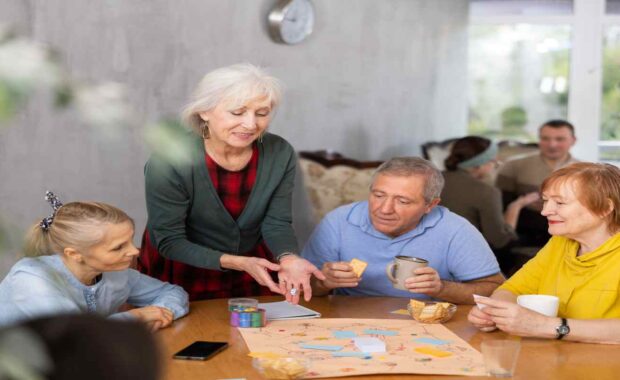 Elderly People Playing Board Game Together