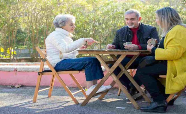 Elderly People Playing Cards in Park in Northern VA